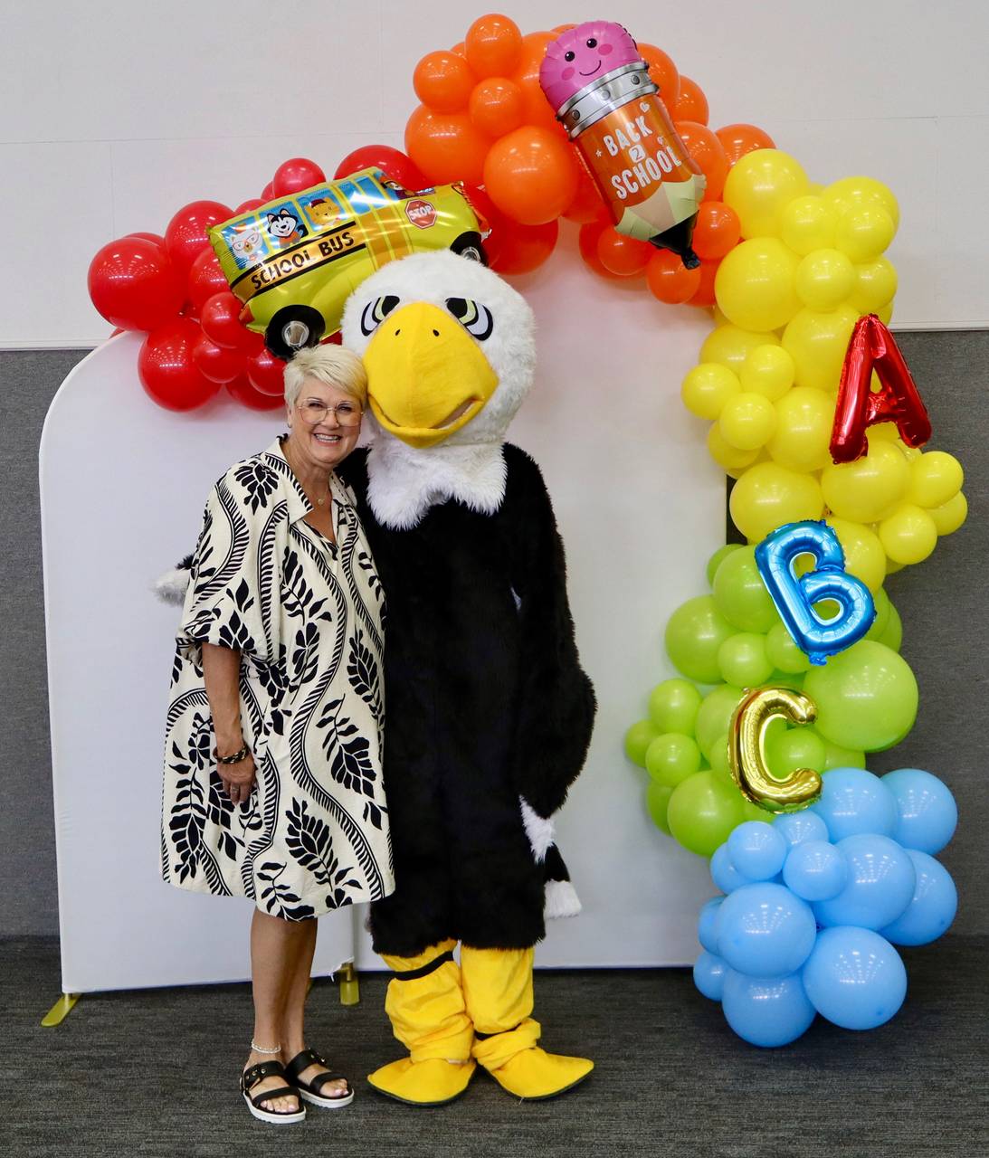 An SCA staff member with the school's Eagle mascot at a Back to School event in Stephenville, TX