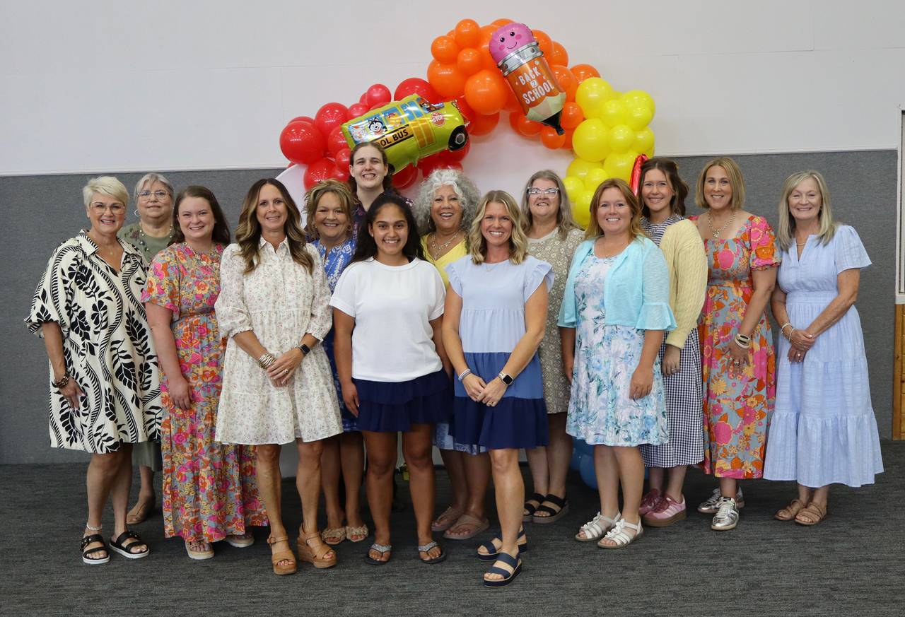 Stephenville Christian Academy teachers and staff smiling together at a back-to-school celebration in Stephenville, TX